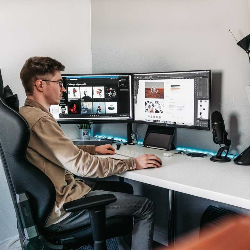 A guy making designs that I assume he will sell on Fiverr